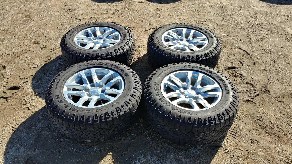 (I-1) (4) WRANGLER GOODYEAR 265/65 R18 APPROX. 8/32 TREAD TIRES W/ (4) 18" ALUMINUM ALLOY RIMS (FITS GM '88 AND UP)