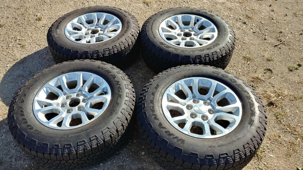 (I-25) (4) GOODYEAR WRANGLER LT265/70 R18 APPROX. 14/32 TREAD TIRES W/ (4) 18" CHROME ALUM RIMS (FITS GM 6-BOLT '88 AND UP)