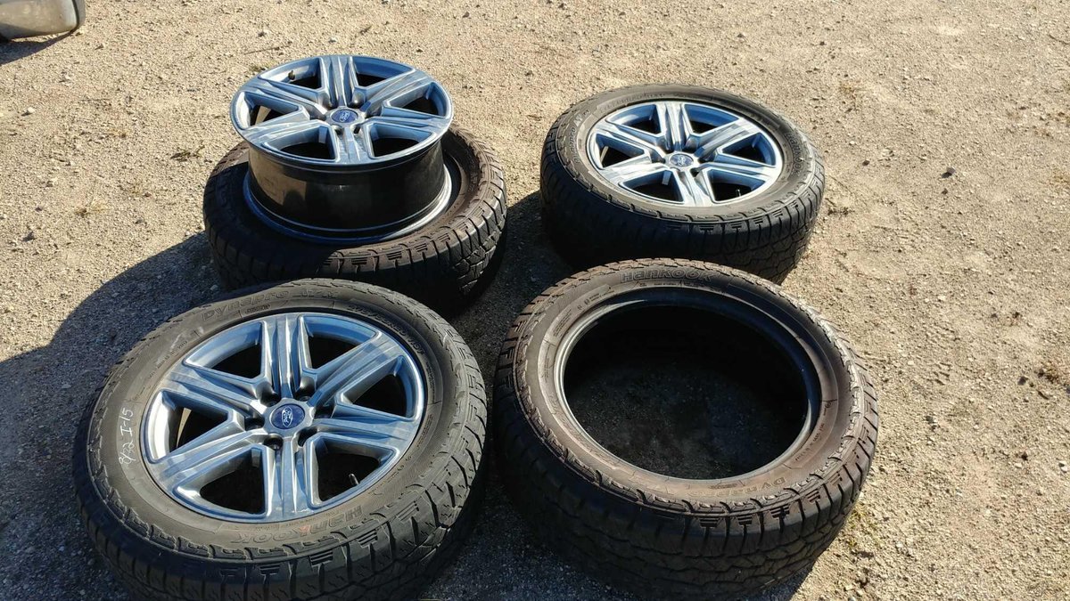 (I-15) (4) HANKOOK DYNAPRO ATM 275/55 R20 APPROX. 8/32 TREAD TIRES W/ (3) 20" FORD ALLOY RIMS