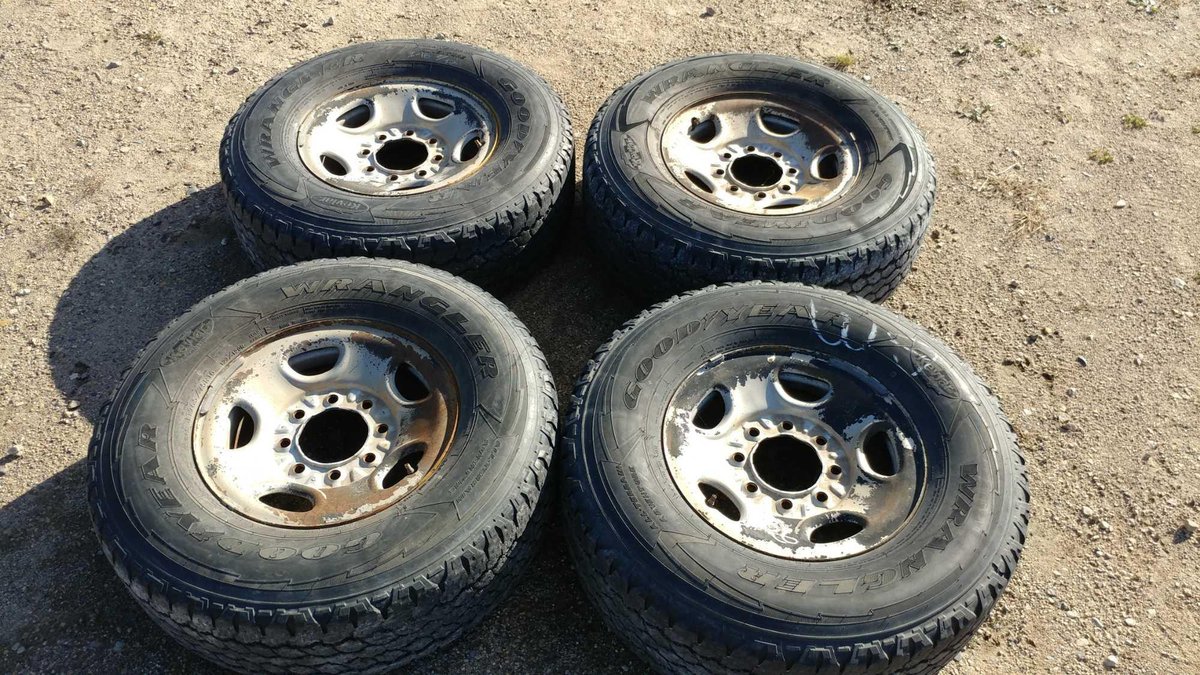 (I-16) (4) GOODYEAR WRANGLER LT265/75 R16 APPROX. 6/32 TREAD TIRES W/ (4) 16" STEEL RIMS (FITS GM '10 AND UP)