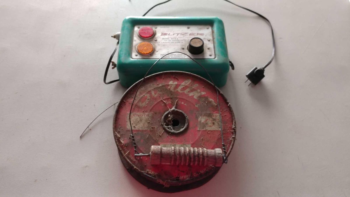 BLITZER ELECTRIC FENCE CHARGER, ROLL OF FENCE WIRE, AND INSULATOR HANDLE