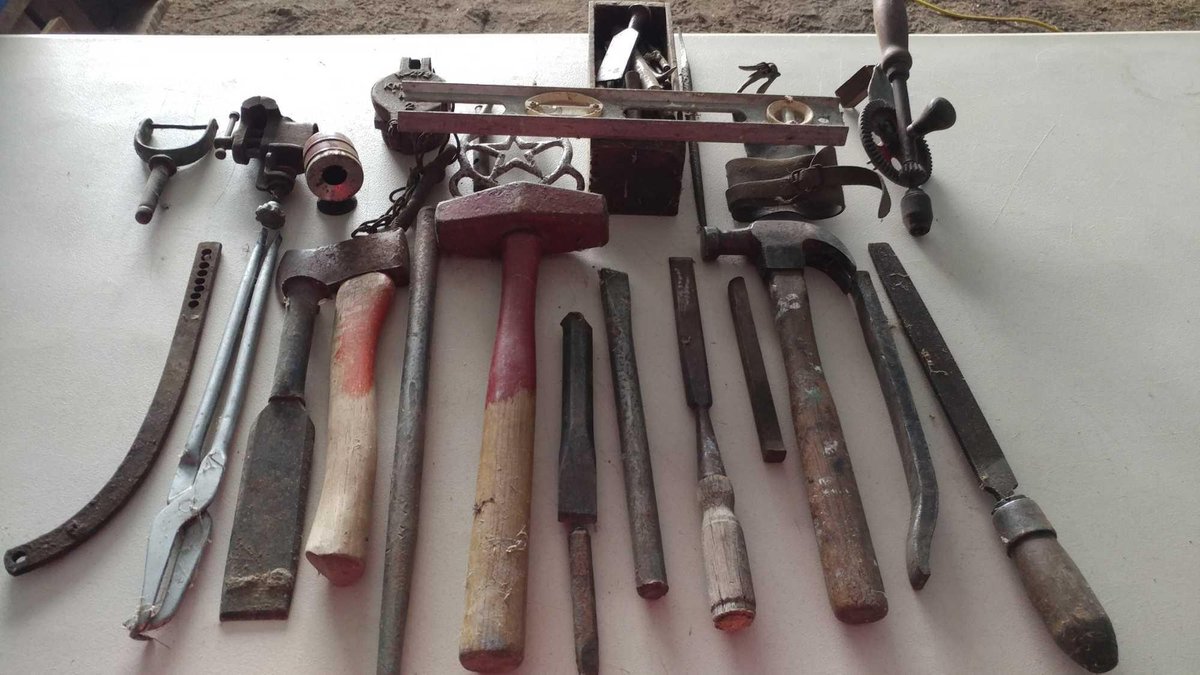 ASSORTMENT OF AXES, HAMMERS, CHISELS, LEVEL, AND MISC