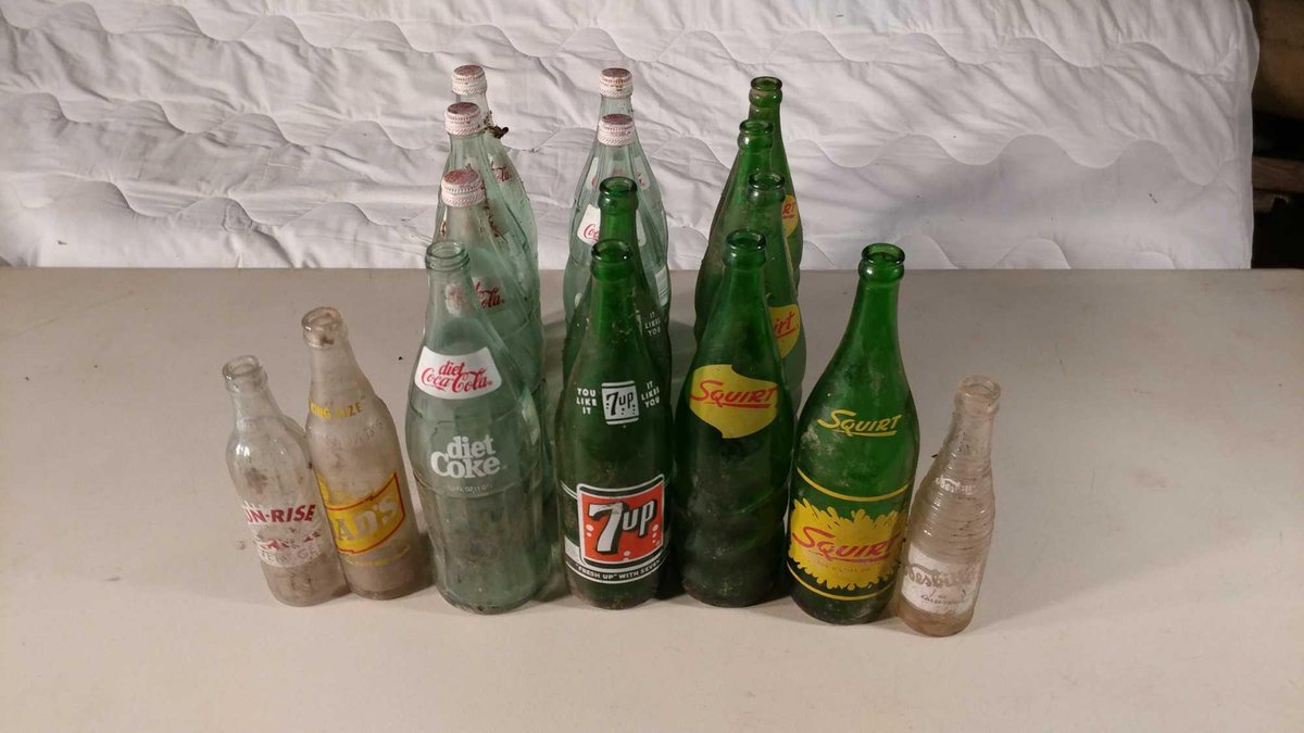 ASSORTMENT OF VINTAGE DIET COKE, 7 UP, SQUIRT, AND DAD'S ROOT BEER BOTTLES