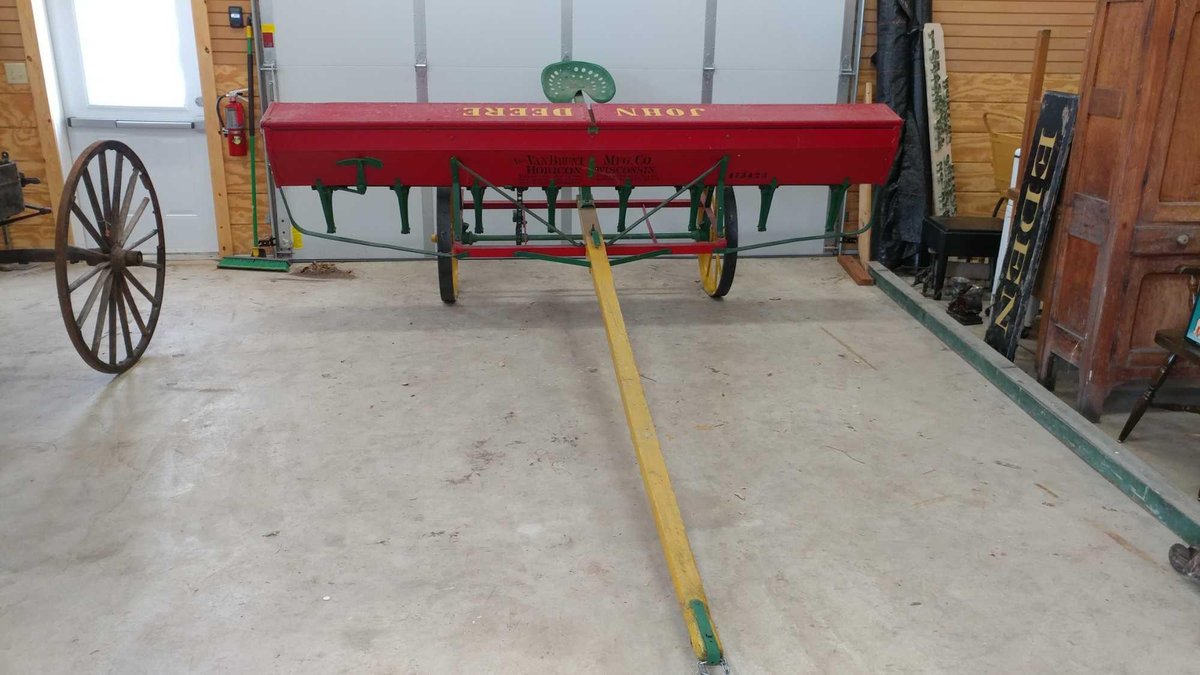 SEEDER - VAN BRUNT BROADCAST SEEDER. WOOD BOX WITH METAL WHEELS. IT WAS HORSE DRAWN AND USED LAST IN