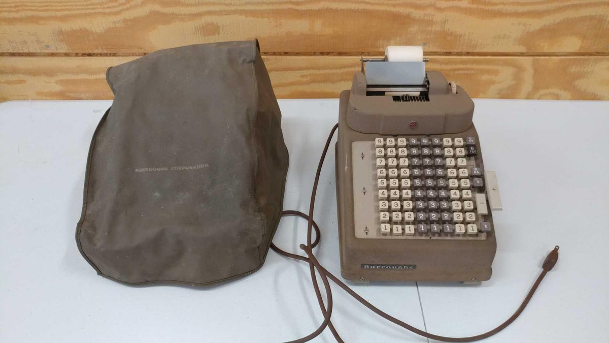 ADDING MACHINE. BOURRUGHS BRAND ELECTRIC ADDING MACHINE. IT PRINTS TO A ROLL OF PAPER AND HAS A VINY