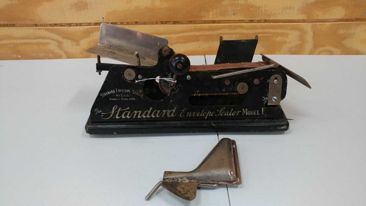 ENVELOPE SEALER, MADE BY THE STANDARD ENVELOPE SEALER MANUFACTURING COMPANY. IT IS A MODEL F AND SIT