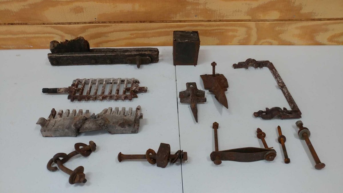 GROUP OF OLD BOLTS, STOVE GRATE PARTS, AND OTHER OLD HARDWARE