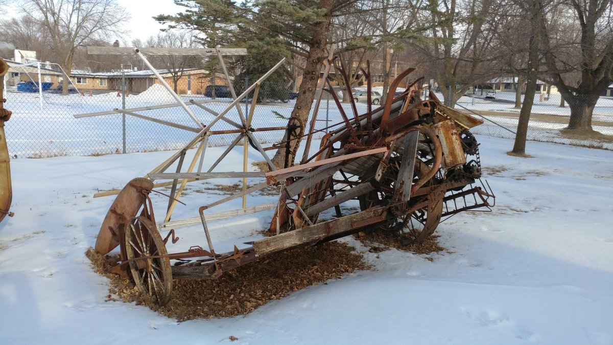 GRAIN BINDER FOUND IN THE LOG BUILDING. FAIRLY GOOD CONDITION.