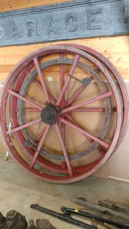 TWO WHEELS - TREAD MILL PULLEYS, ONE HAS A GOVERNOR ON IT. ACCORDING TO THE ORIGINAL SUBJECT CARD, I