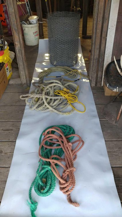 (A) LENGTHS OF ROPE, ROLL OF CHICKEN WIRE, AND PAIL W/ELECTRIC FENCING SUPPLIES 