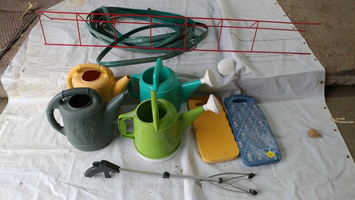 (B) GARDEN HOSE, WATER CANS, KNEELING PADS, AND RED WINE TRELLIS 