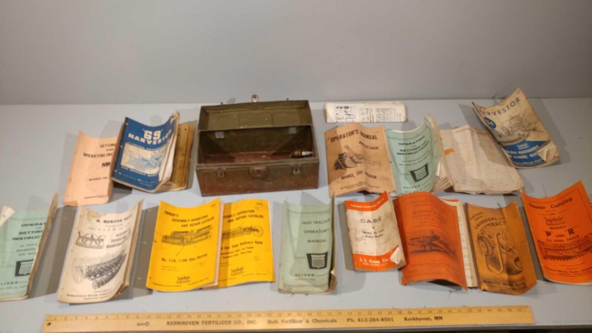 METAL TOOL BOX W/ASSORTMENT OF VINTAGE IMPLEMENT MANUALS