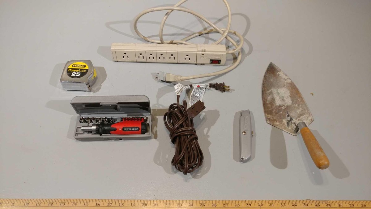 SMALL SOCKET SET, TROWEL, INDOOR EXTENSION CORD, POWER STRIP, UTILITY KNIFE, AND TAPE MEASURE 