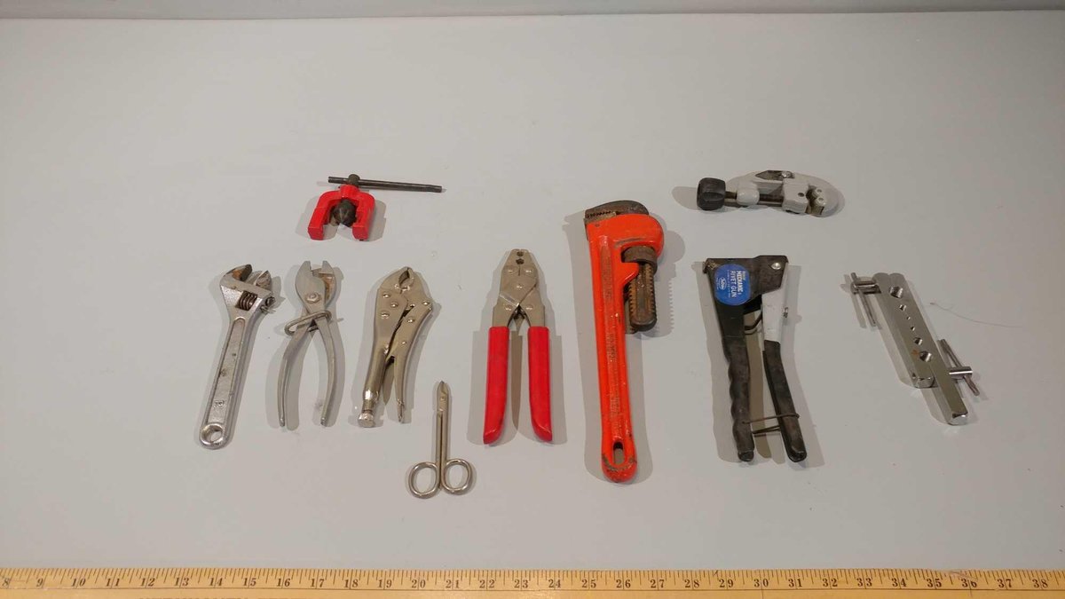 PIPE WRENCH, PLIERS, RIVET GUN, CRESCENT WRENCH, PIPE CUTTER, VISE GRIPS, AND MISC