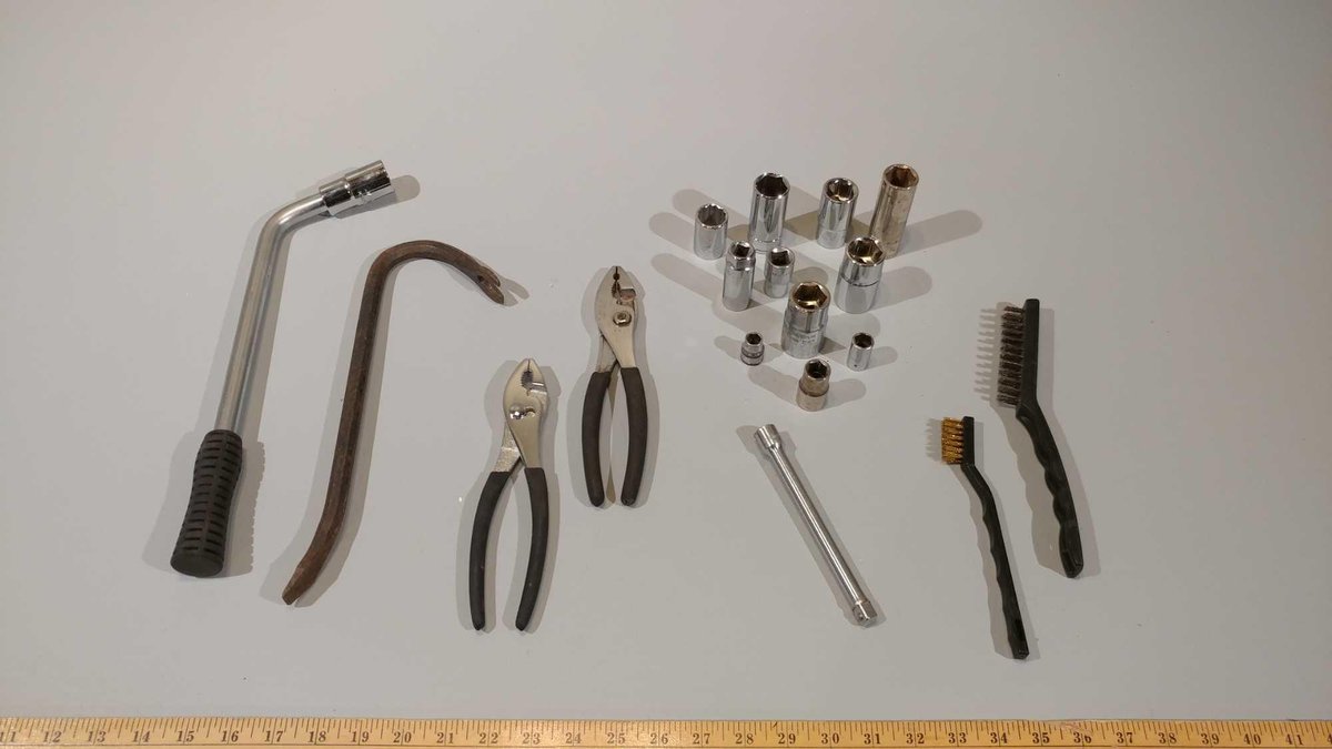 SOCKETS, PLIERS, WIRE BRUSH, AND SMALL PRY BAR