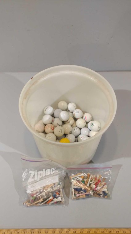 LARGAE ASSORTMENT OF GOLF BALLS AND TEES
