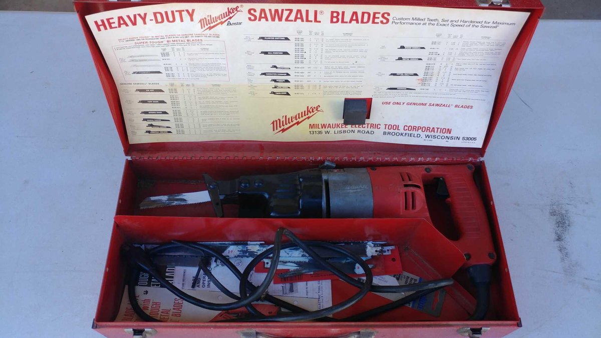 MILWAUKEE SAWSALL W/BLADES AND CASE, TESTED AND WORKS