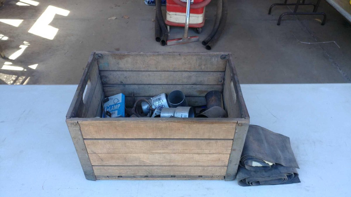 ASSORTMENT OF MUFFLER CLAMPS, RUBBER BELTING, AND STEEL TUBING 