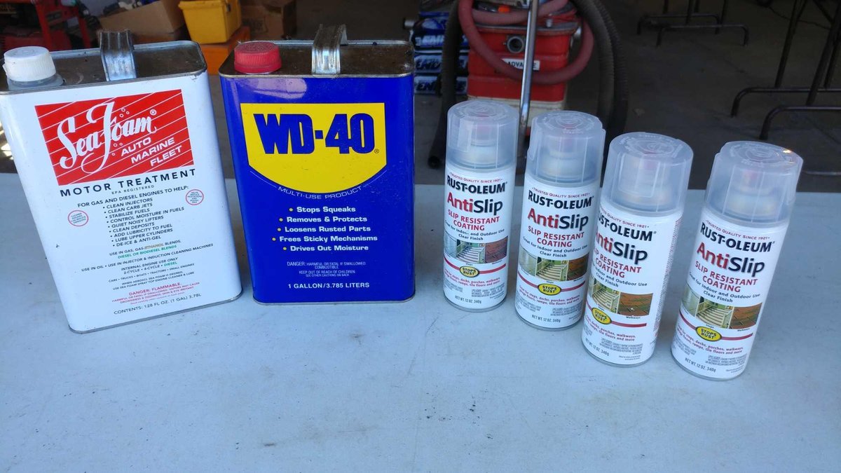 (4) CANS OF ANTI-SLIP COATING, WD-40 (HALF FULL), AND SEAFOAM (1/4 FULL)