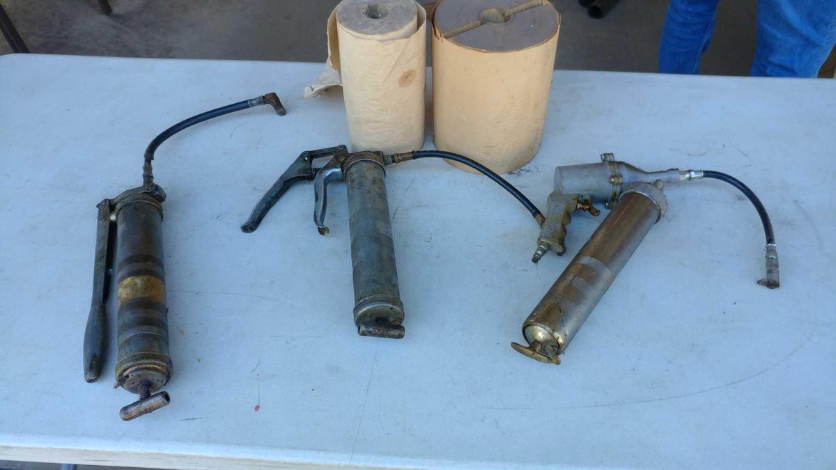 (3) GREASE GUNS AND (2) ROLLS OF PAPER TOWELS