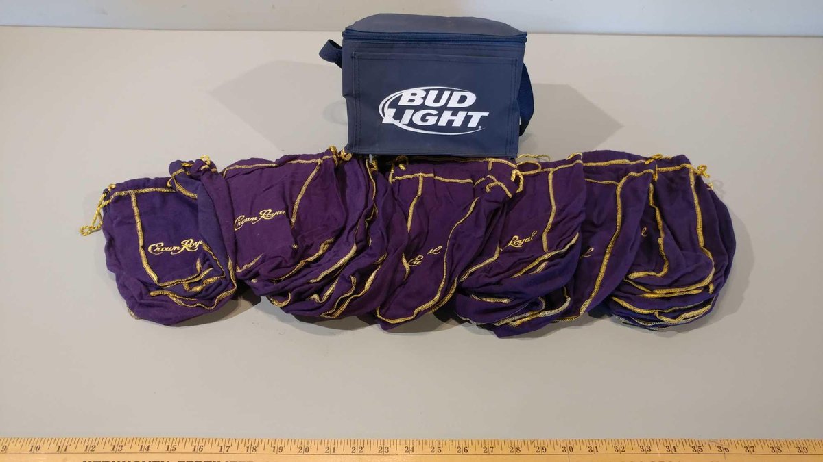 ASSORTMENT OF CROWN ROYAL FABRIC BAGS AND BUD LIGHT COOLER