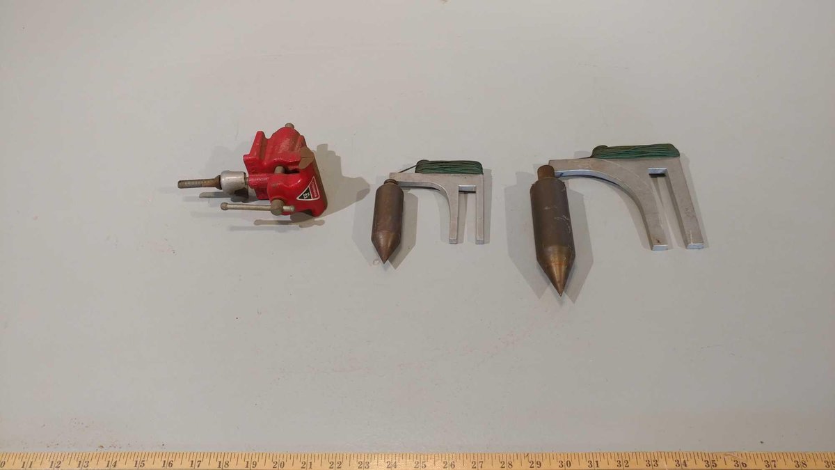 (2) METAL PLUMB BOBS AND A COLUMBIAN TABLE VISE