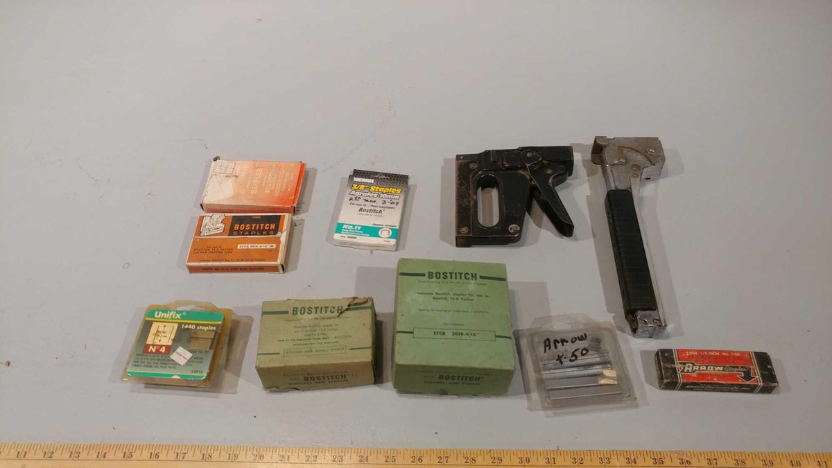 (2) STAPLE GUNS AND AN ASSORTMENT OF STAPLES