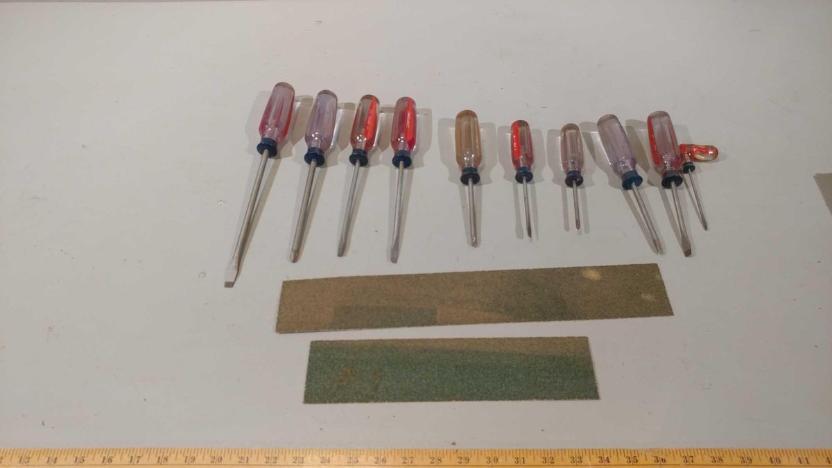 ASSORTMENT OF SCREWDRIVERS AND SAND PAPER