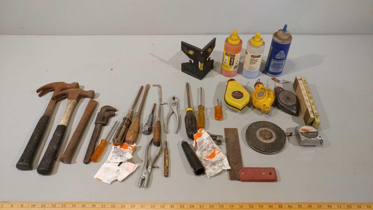 ASSORTMENT OF TAPE MEASURES, CHALK LINES, PLIERS, HAMMERS, SQUARE, MEASURING YARDSTICK, & OTHER I