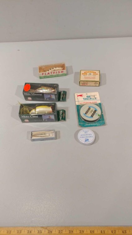 ASSORTMENT OF FISHING HOOKS, TIP UP LINE, AND FISHING LURES