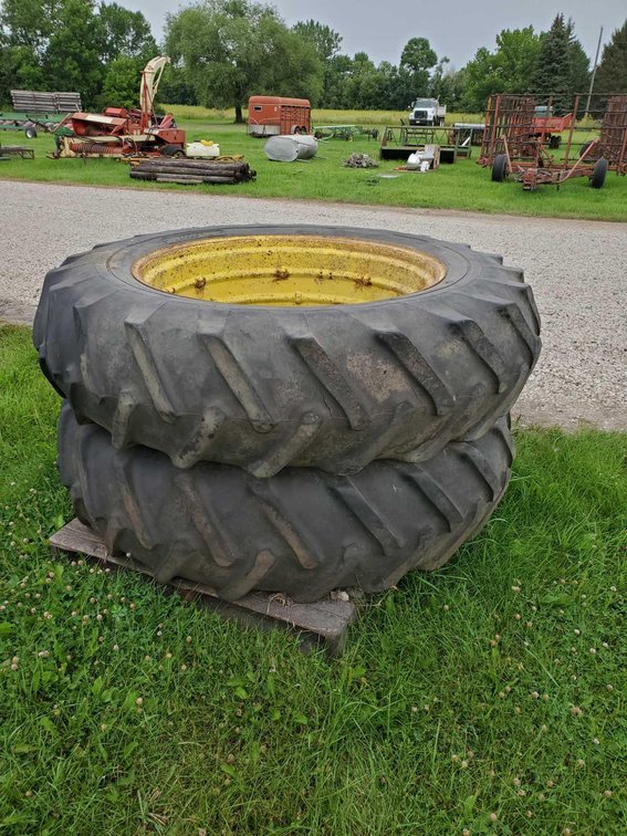  (I-237) 16.9-38 TIRE ON JD RIMS 
