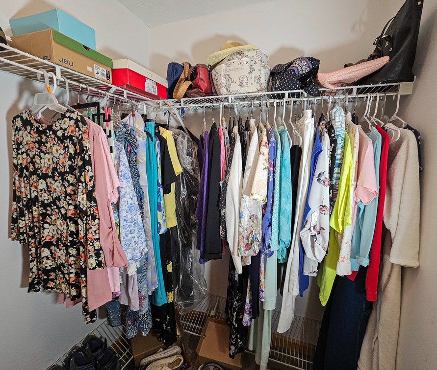 Ladies Clothes in Bathroom Closet