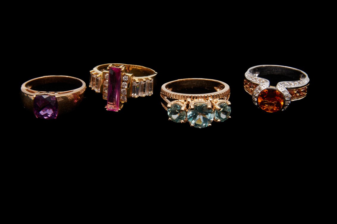 Four Sterling Silver Rings with Gemstones- 20.96 G
