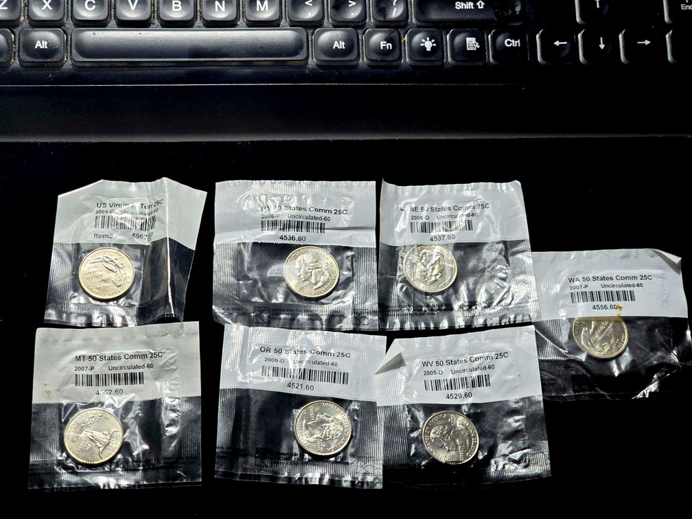 7 State Quarters in Littleton Coin Company Packaging