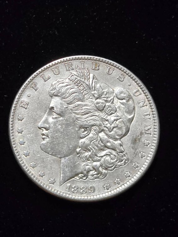 1889 Morgan Silver Dollar Coin with Approximate Grade AU