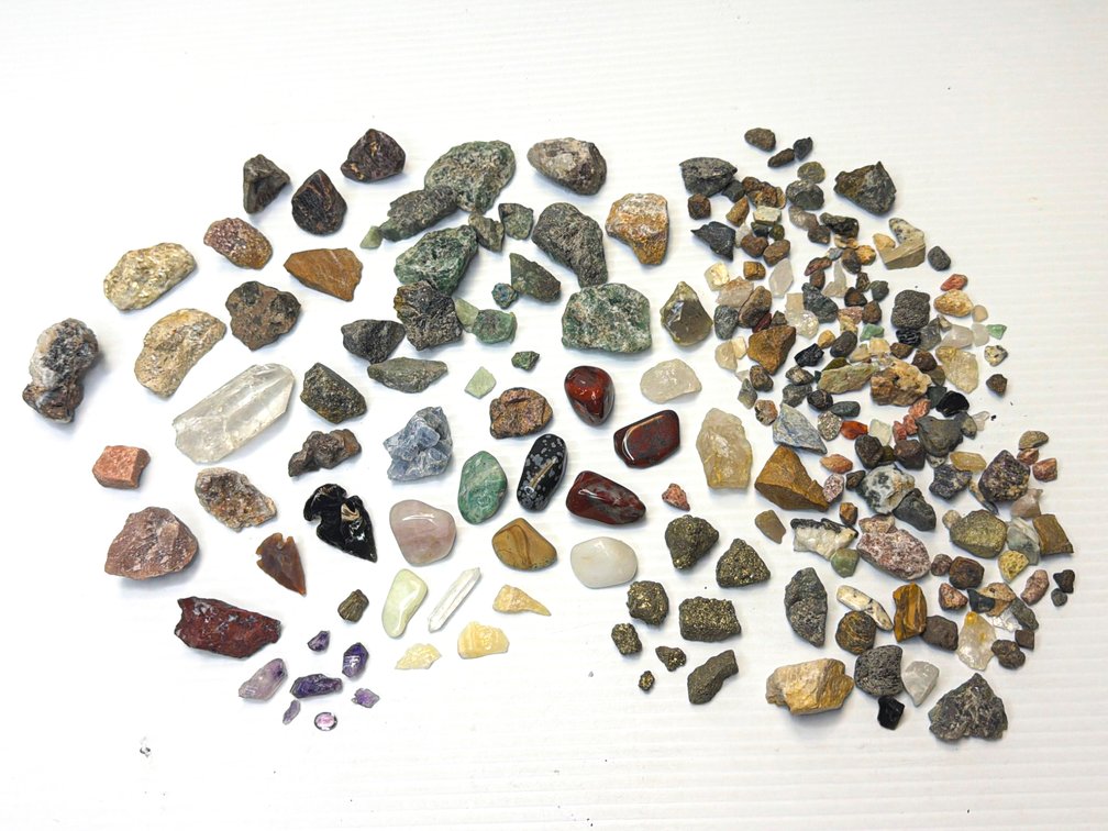 Pair of Arrowheads and Assortment of Polished and Raw Stones and Minerals