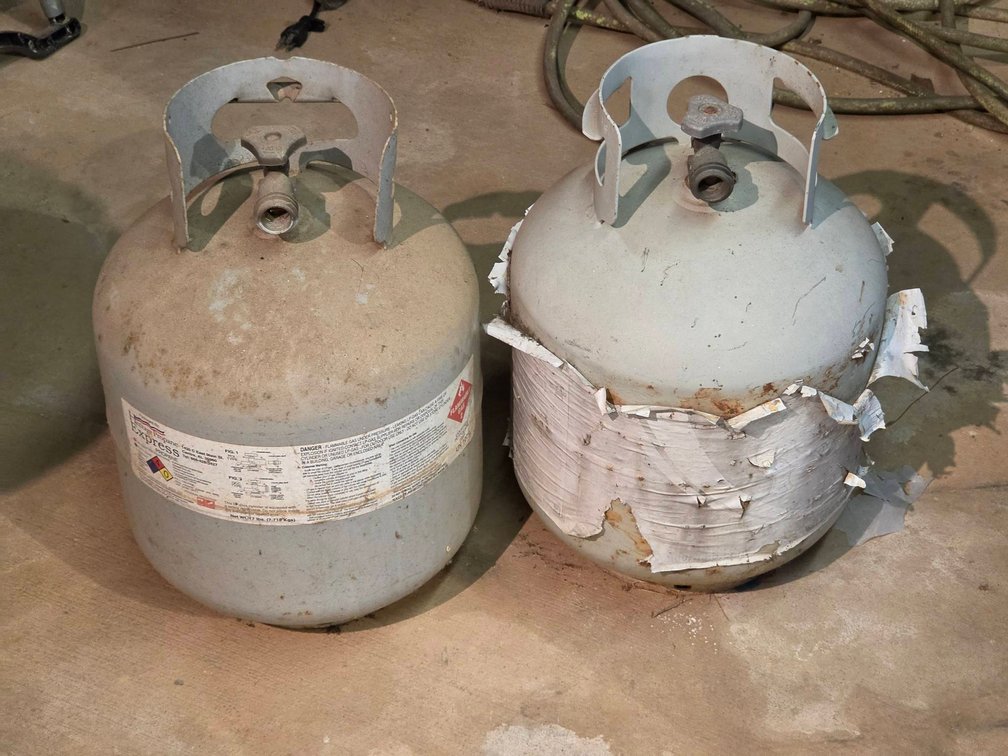 Two Used 20 LB Propane Tanks, One With Propane