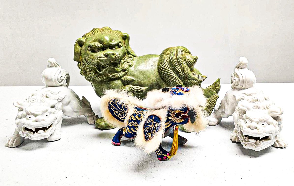 Green Ceramic, White Porcelain, and Ornately Decorated Fabric Foo Dogs
