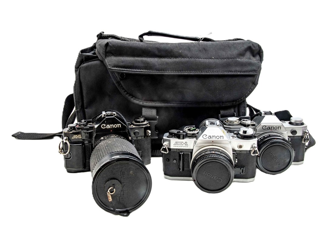 3 SLR Cameras-Canon AE-1 & A-1