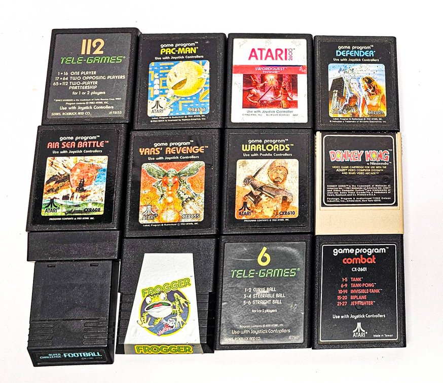 12 Atari 2600 Game Cartridges, Including Pac-Man, Frogger, and Donkey Kong