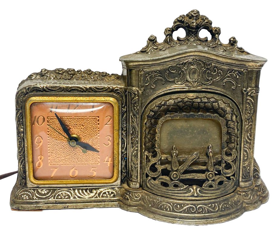 United Clock Corp Model 564 Metal Electric Clock with Fireplace Design