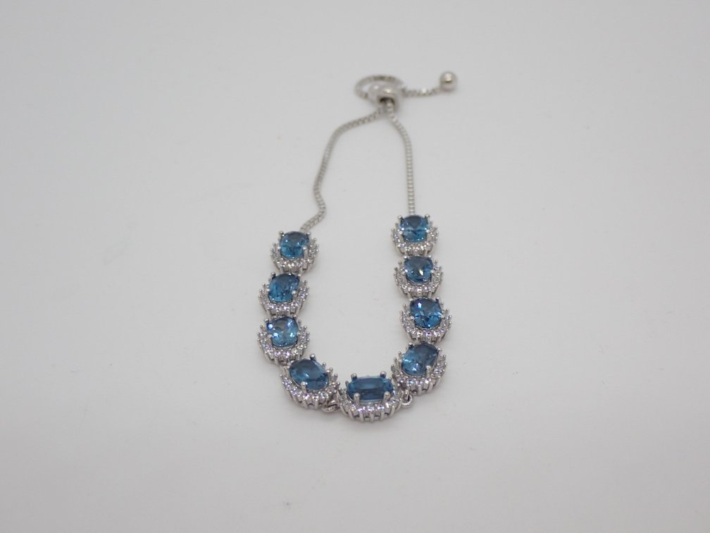 Blue Topaz with White Zircons