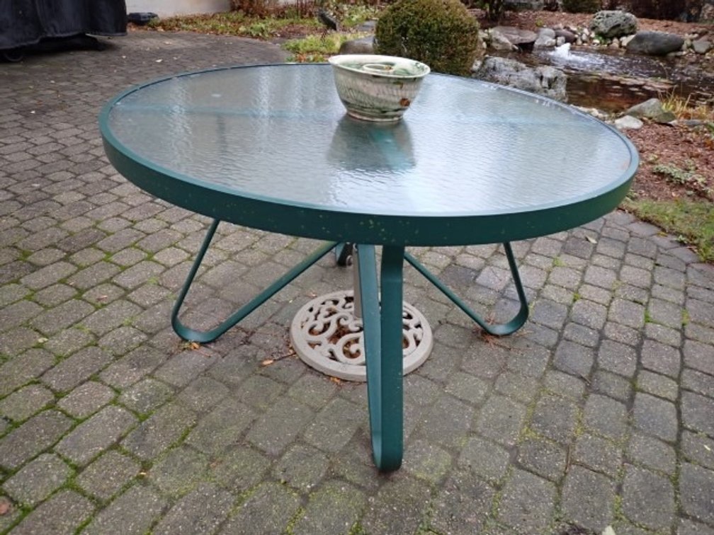 Green Metal and Glass Patio Table With Umbrella