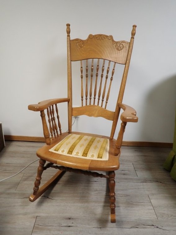 Antique Oak Carved-top Spindle Back Rocking Chair
