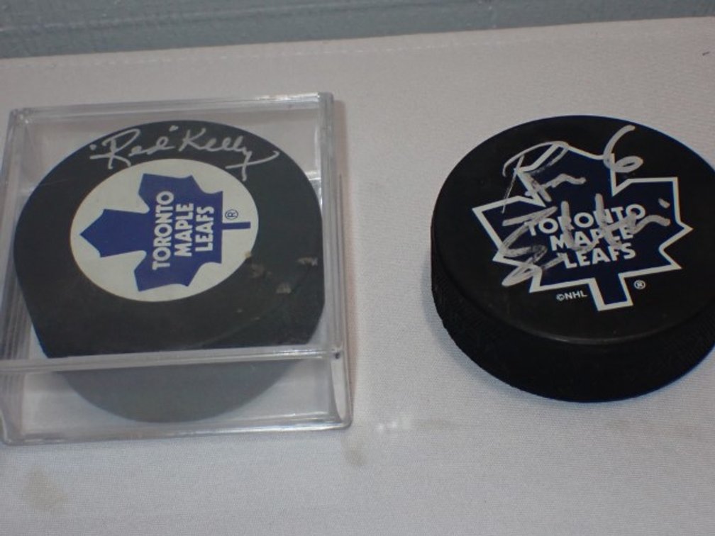 Two Autographed Hockey Pucks