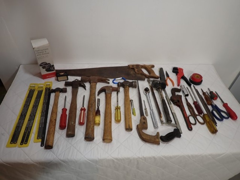 Variety of Saws and Hammers and Toyota Fuel System Cleaner and Anti Freeze