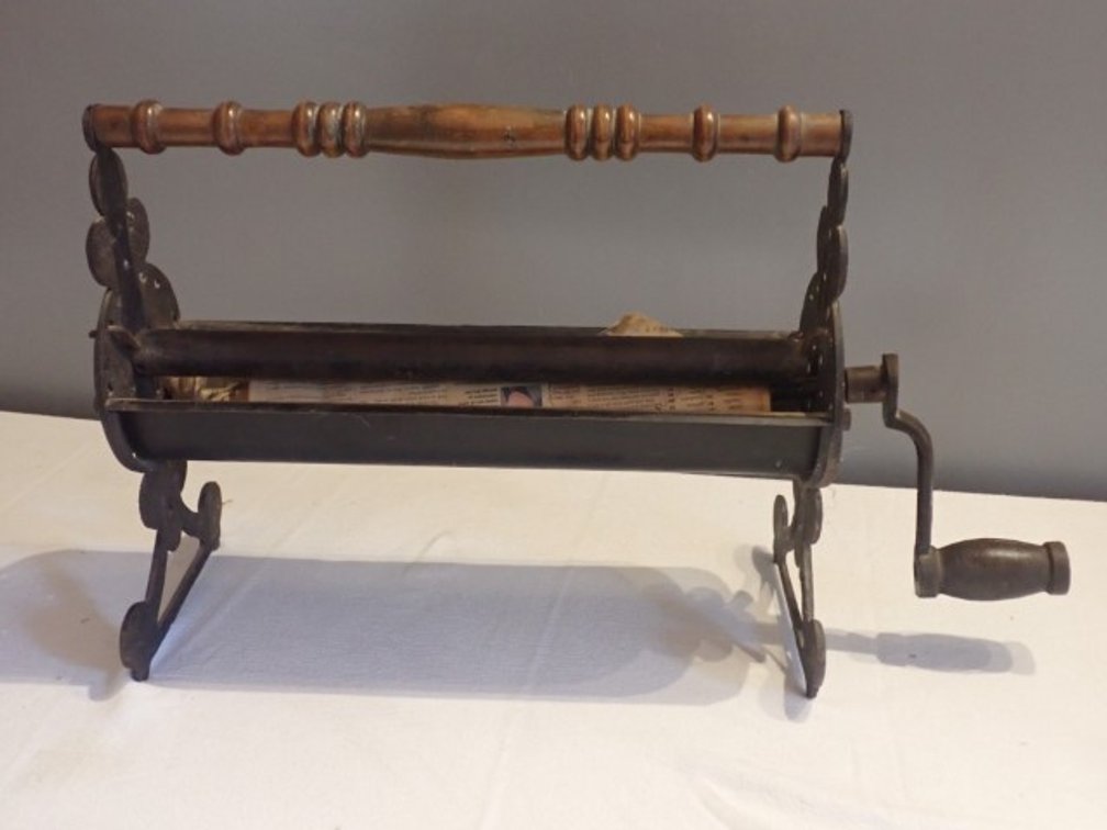 Cast Iron Newspaper Roller