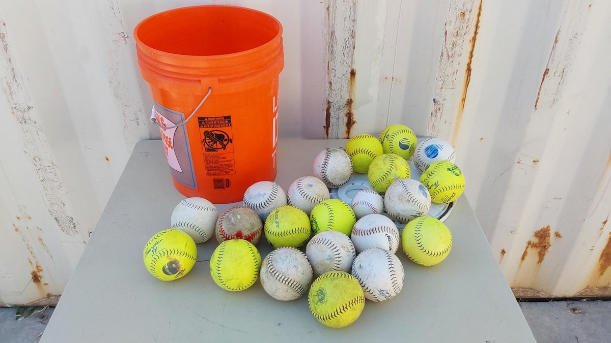 (21) Softballs; (1) Baseball