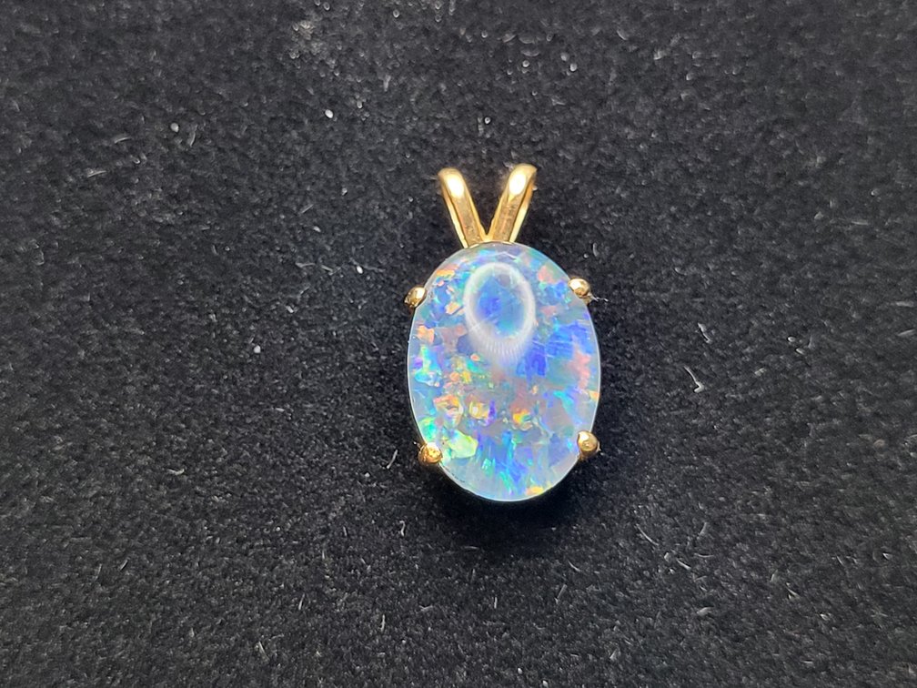 Blue opal with 14K yellow gold bezel pendant