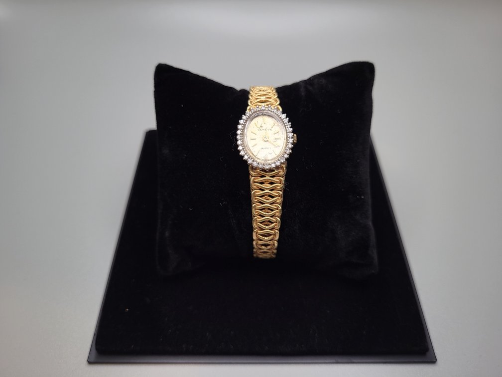 14K yellow gold oval watch with diamond melee 